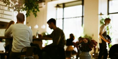 People dining in out of focus view